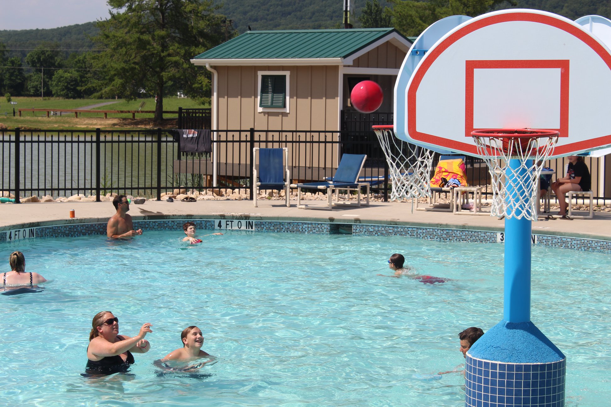 Mother and son playing pool basketball with our 3-Sided Custom Design Basketball Hoop