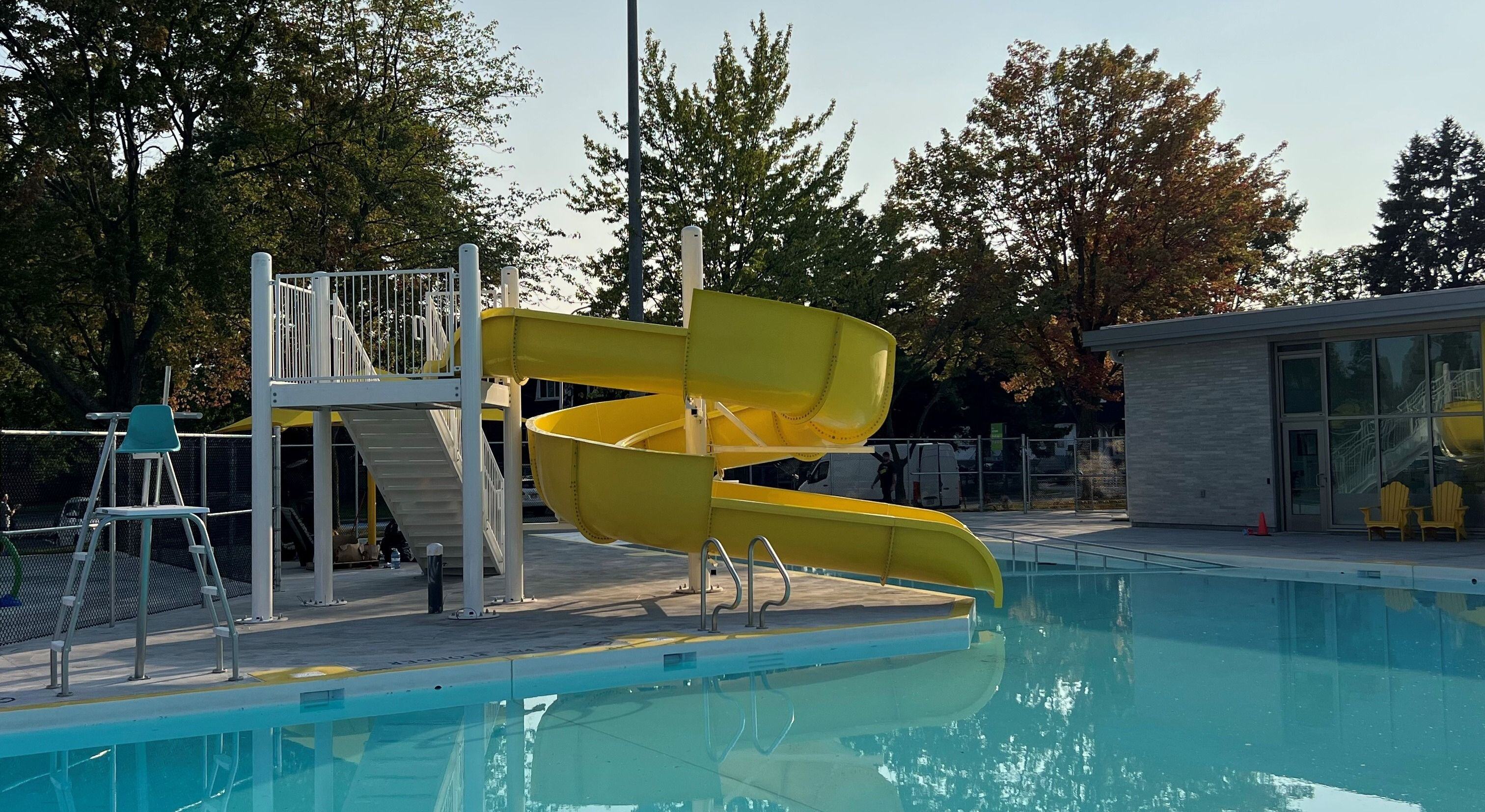 SlideWorx water slide installed at an outdoor pool