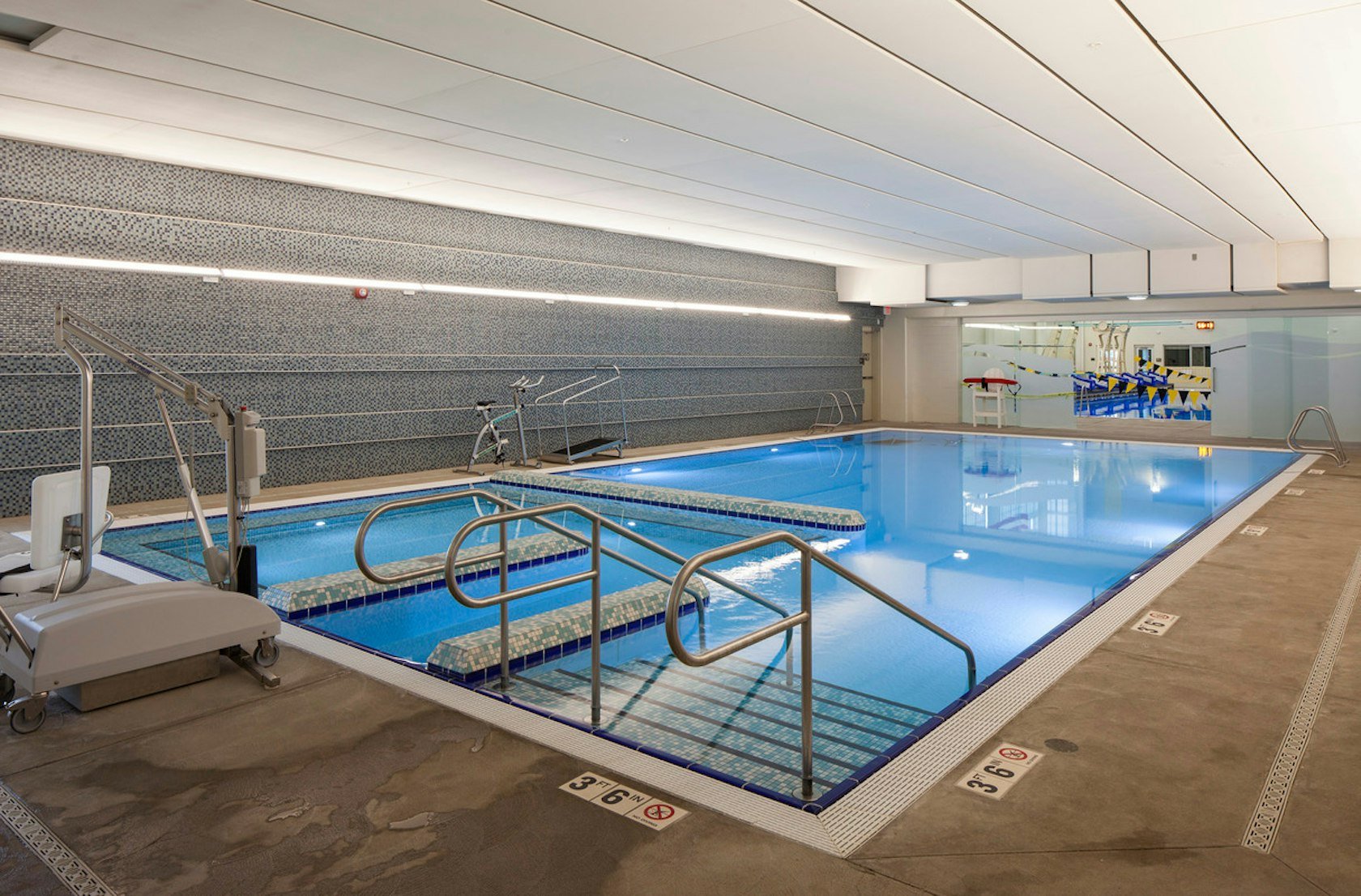 Portable Motion Trek ADA Pool Lift at indoor pool
