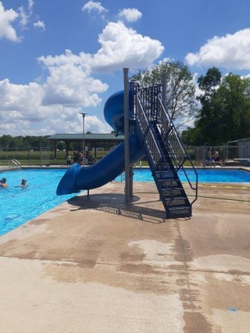 Blue Poolside Slide at outdoor swimming pool
