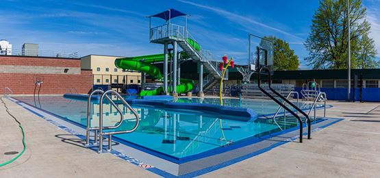 Outdoor aquatic play area with Pike Adjustable Grab Rails