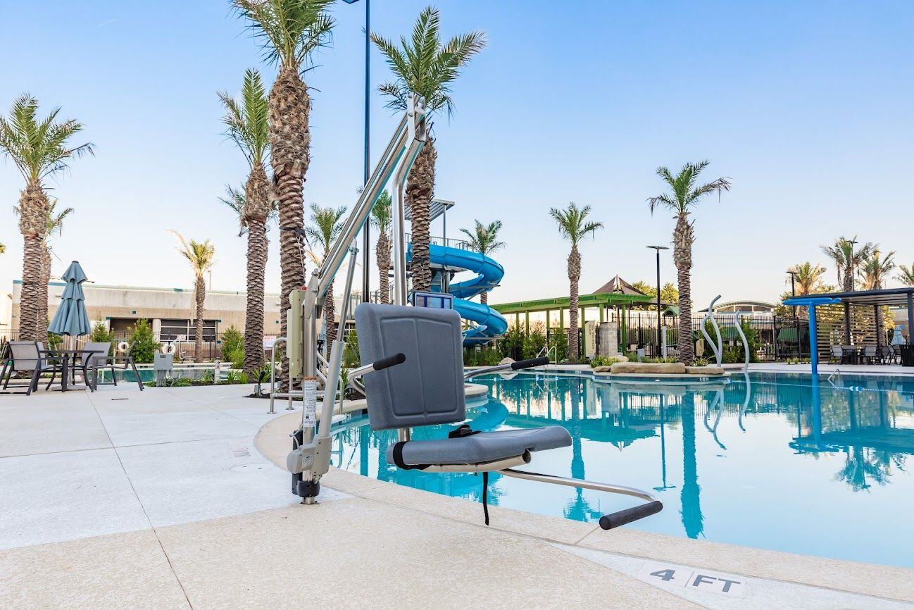 Stainless Steel ADA Handicap Pool Chair Lift at outdoor pool