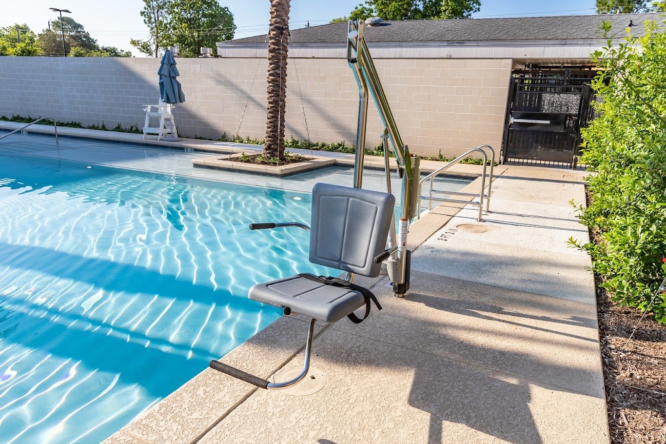 Motion Trek ADA Pool Lift at outdoor pool and spa