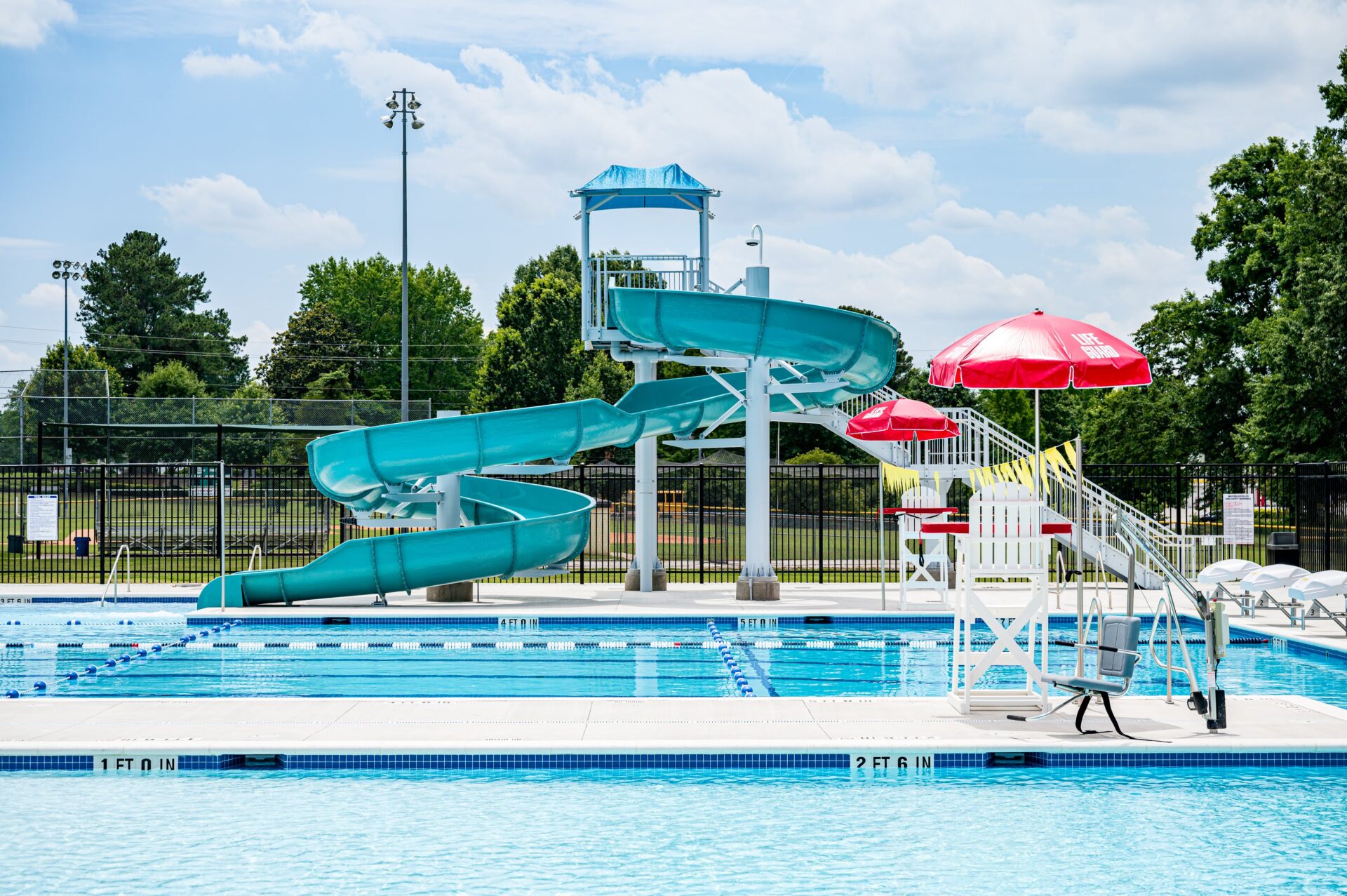 Outdoor aquatic center with ADA Pool Lifts and Lifeguard Chairs