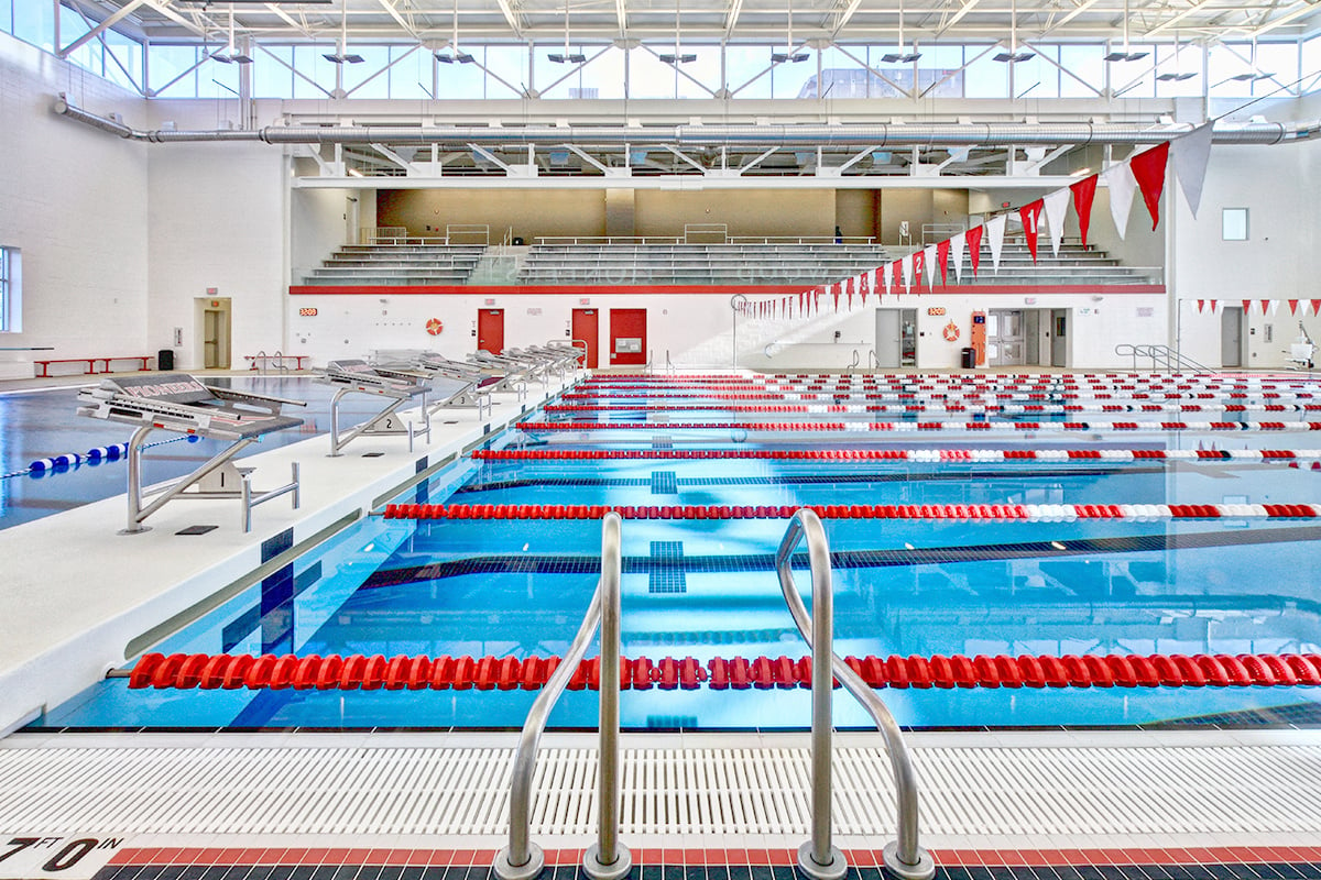 Indoor competition pool with stainless steel rails and swim starting blocks