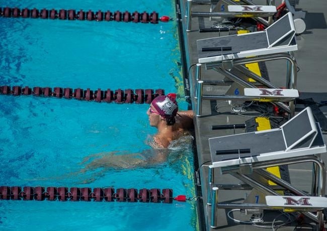 Athlete with the custom dual post Xcellerator swim starting blocks