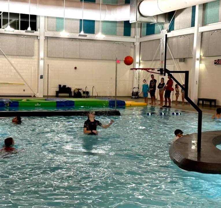 Children playing with Poolside Basketball Hoop