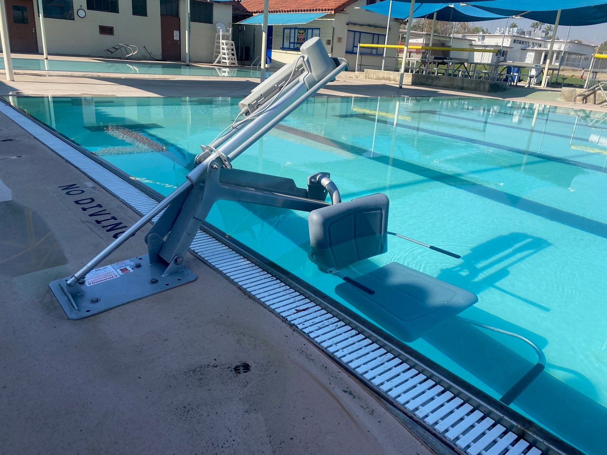 The Aqua Buddy ADA Pool Lift submerged in pool