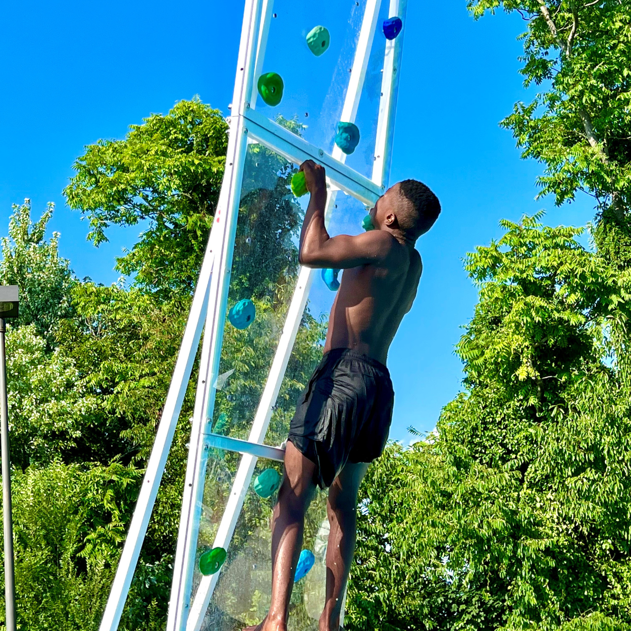 Child on AquaClimb® Krystal Pool Climbing Walls