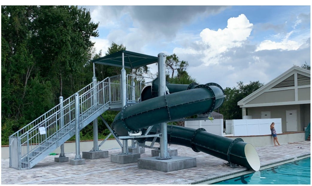 SlideWorx Series Closed Single Flume Poolside Slide at outdoor pool