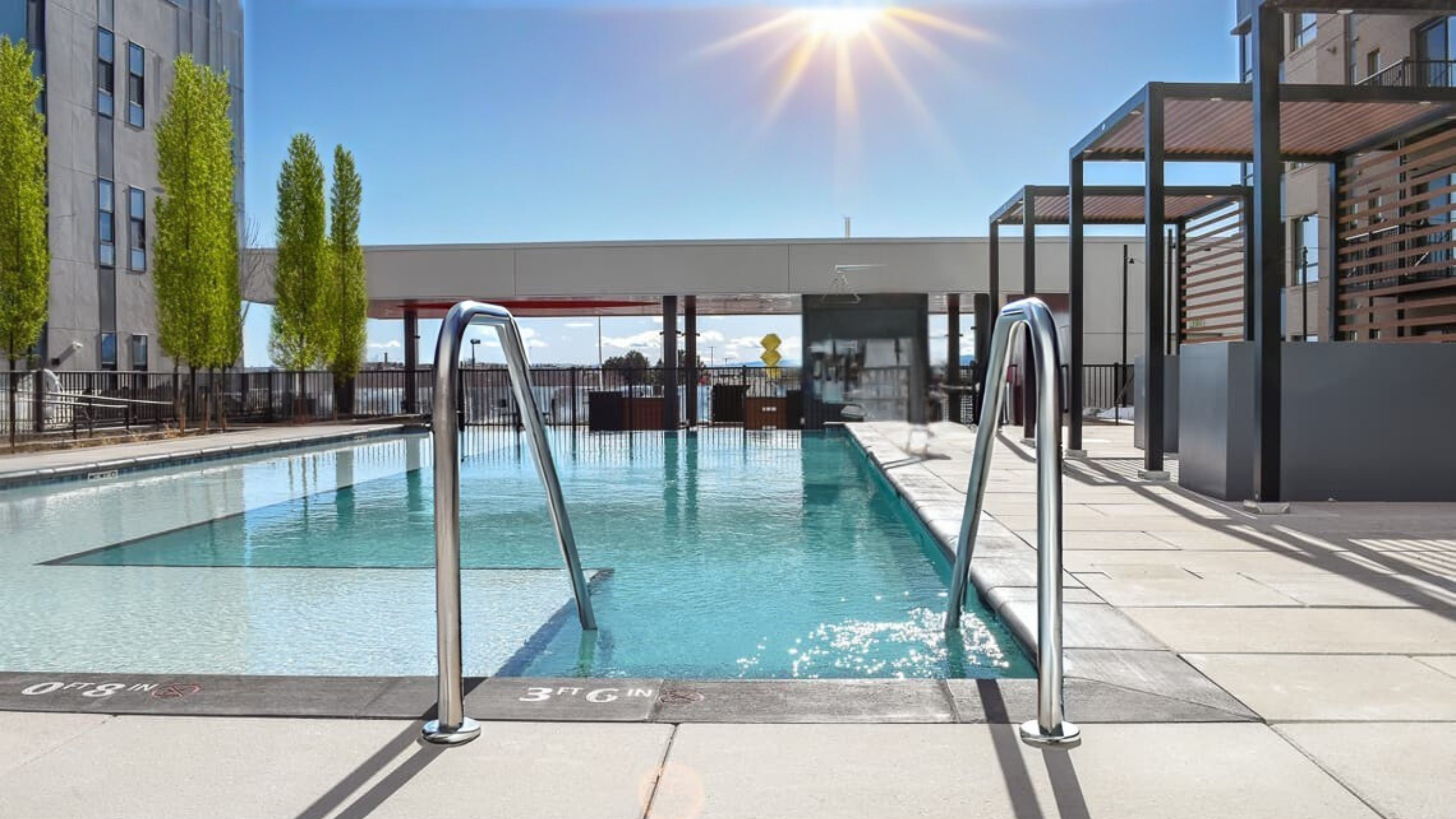 Clean stainless steel pool rails at outdoor pool