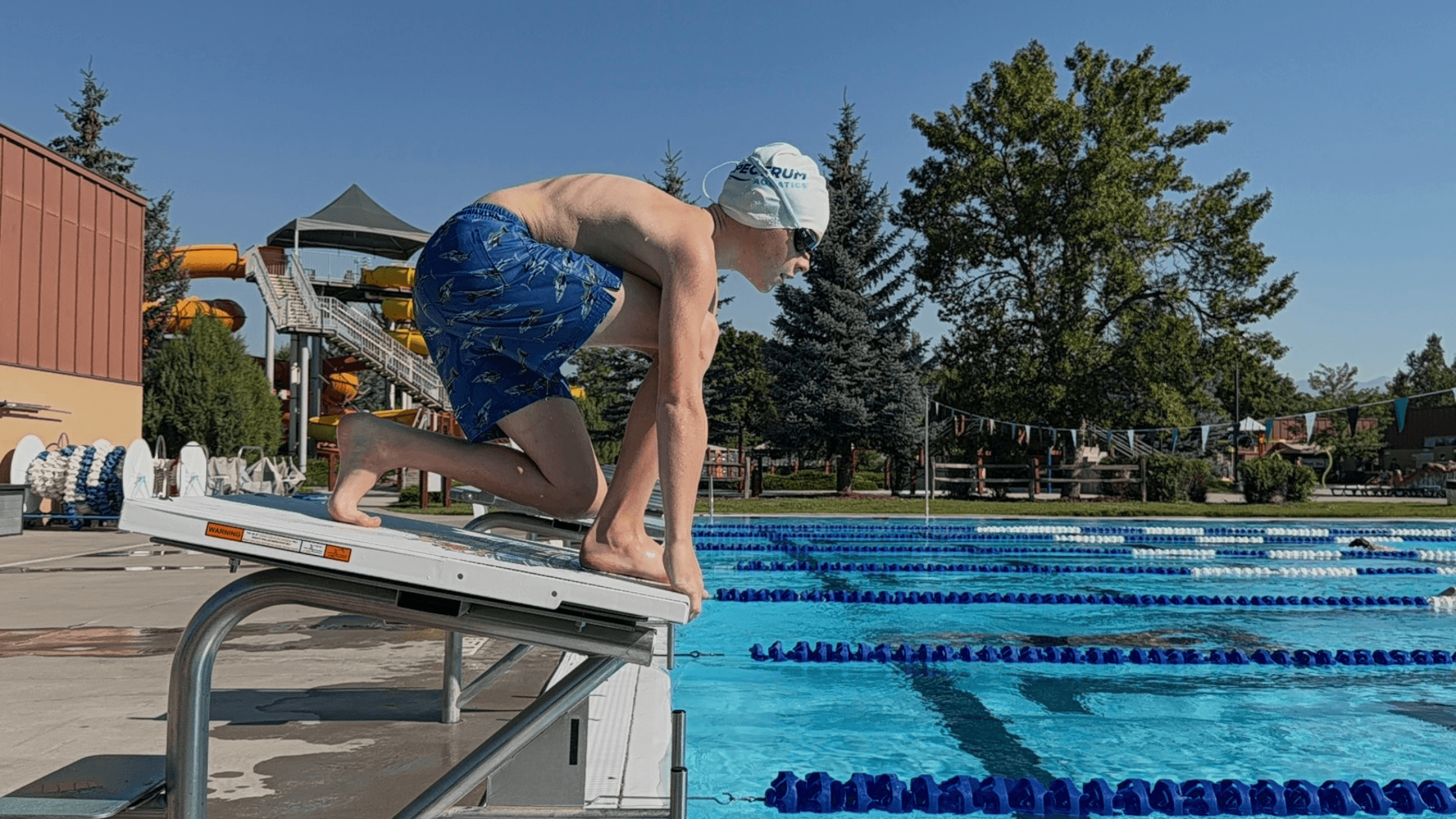 Young male athlete on the Dash Swimming Starting Block