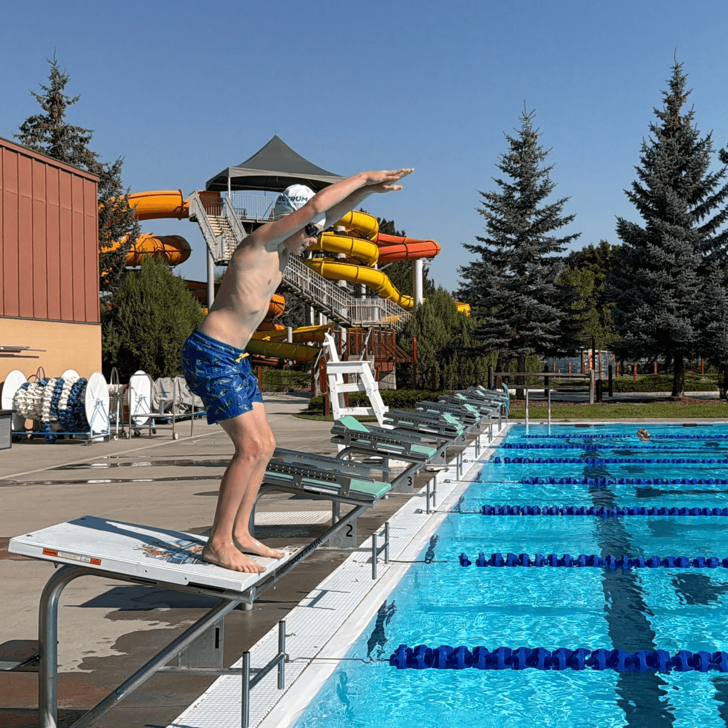 Boy diving off the Dash starting block