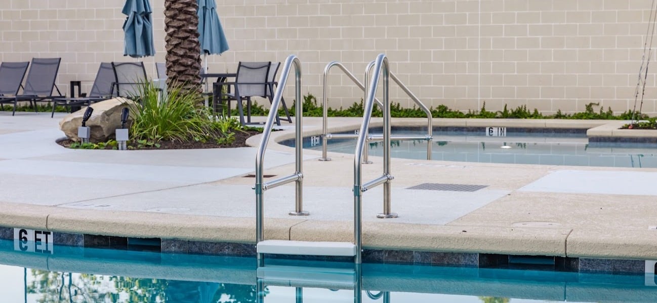 Spectrum Aquatics Stainless Steel Heavy Duty Ladder at outdoor pool 