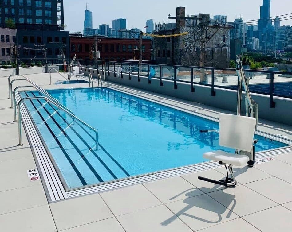 Motion Trek ADA Pool Chair Lift installed at outdoor pool