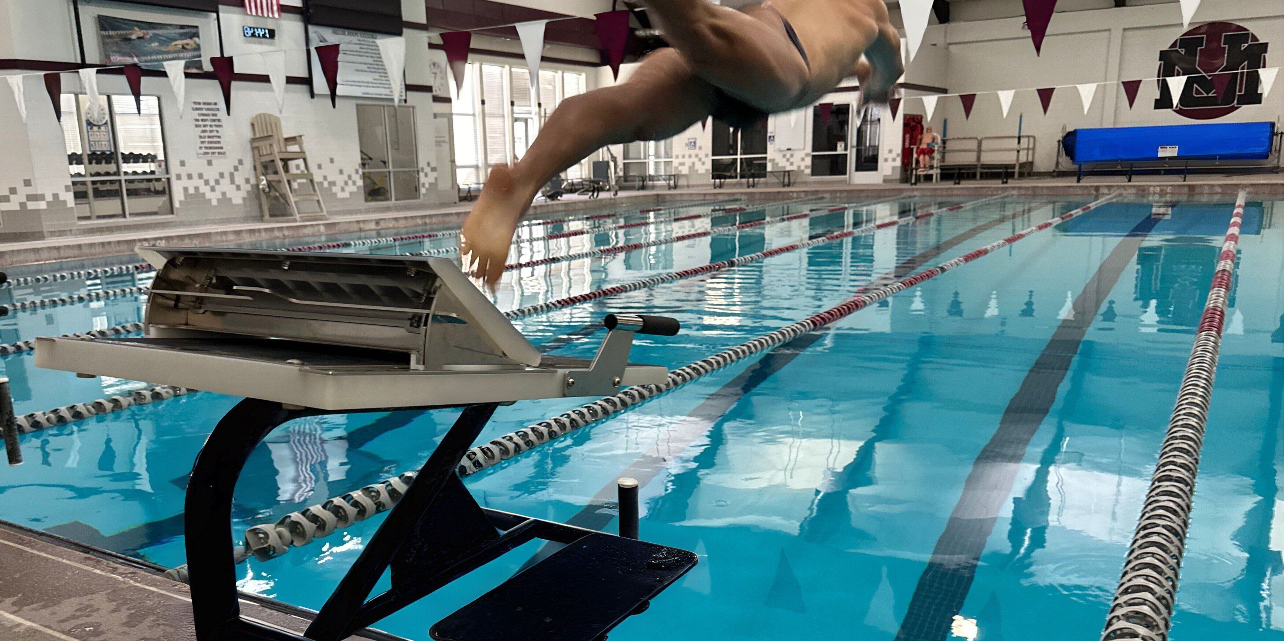 Athlete jumping from Sprint with Rapid Lock Swim Starting Block